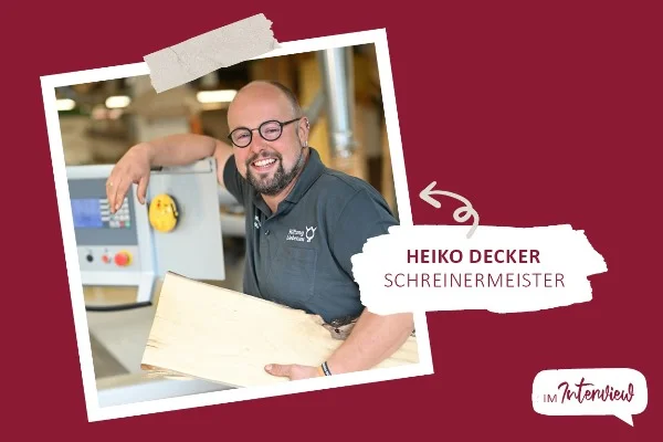 Das Bild zeigt einen Mann der in die Kamera lächelt